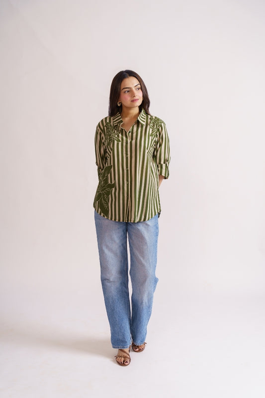 Woman wearing olive stripe floral print cotton shirt with jeans