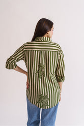 Olive striped shirt with oversized floral overlay, back view