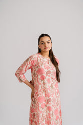 Women wearing cream floral block print straight kurti with contrast geometric pants – Ekisha