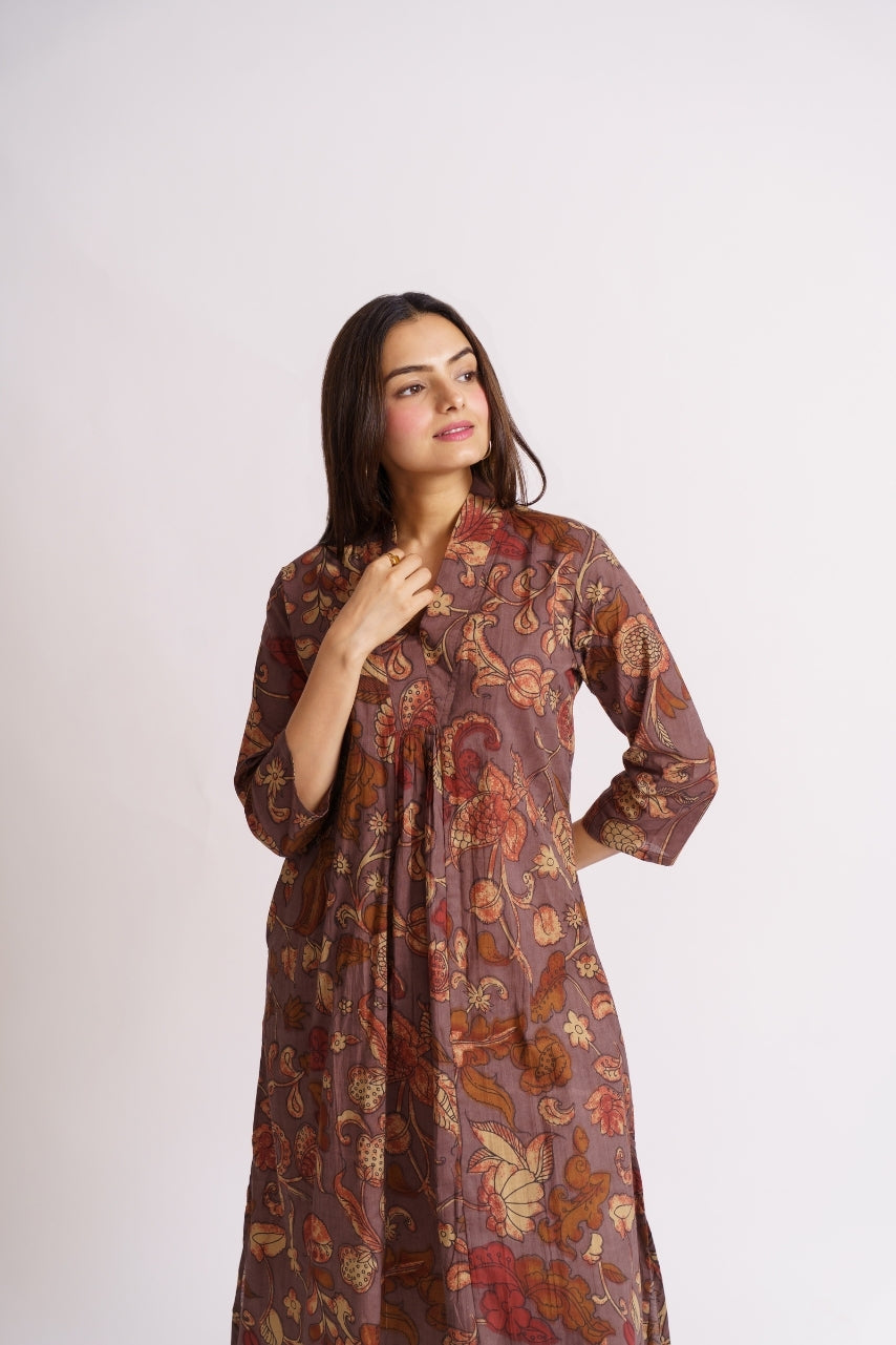 Model wearing full-length mauve floral co-ord set, standing pose