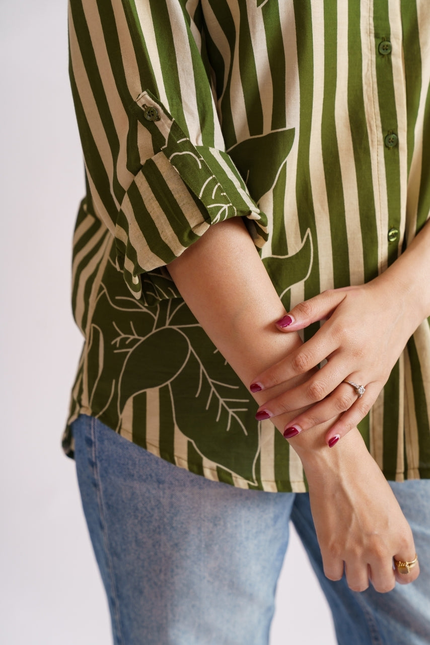 Model wearing oversized olive stripe floral shirt, front pose