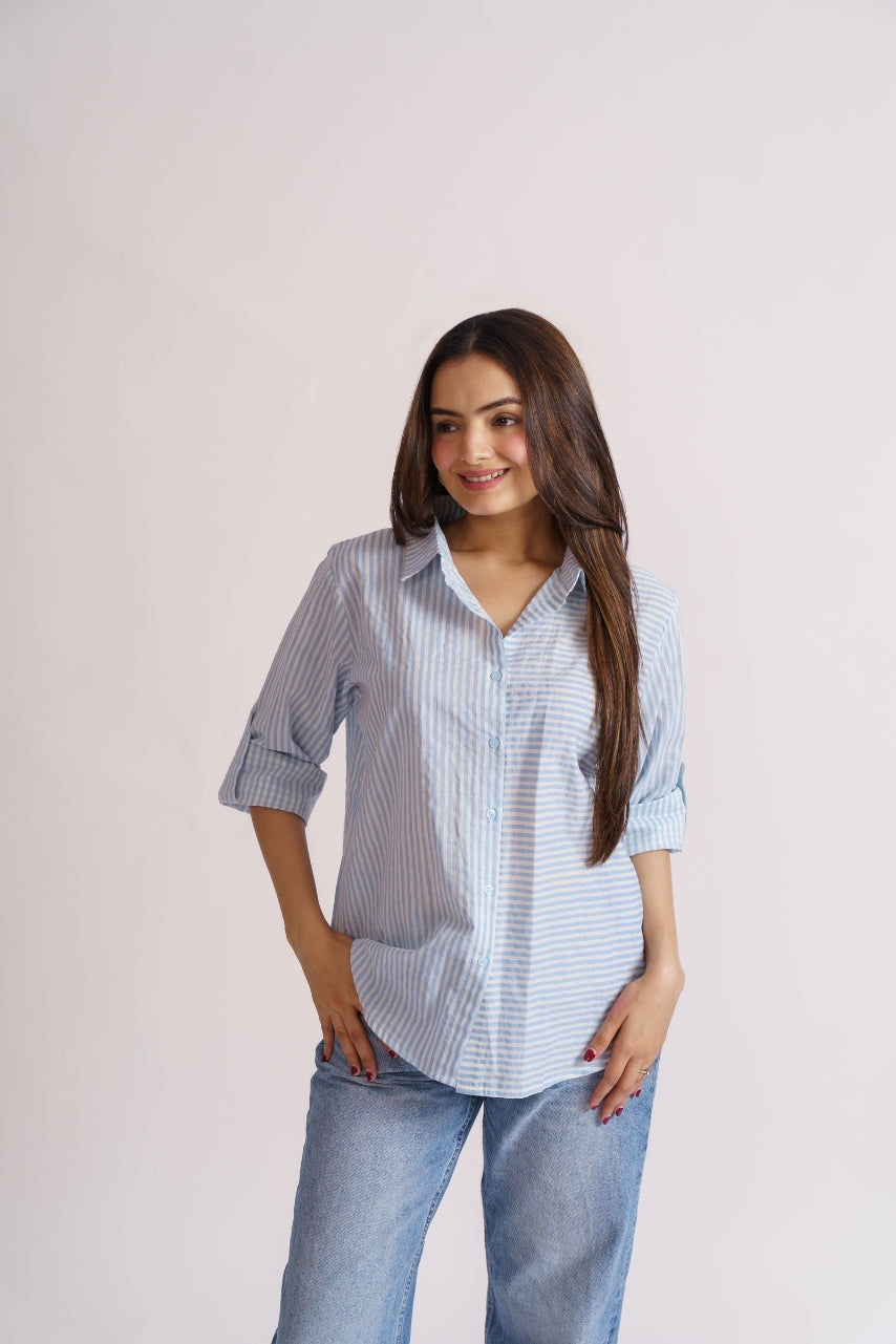 Woman wearing blue stripe cotton button-down shirt, neckline detail