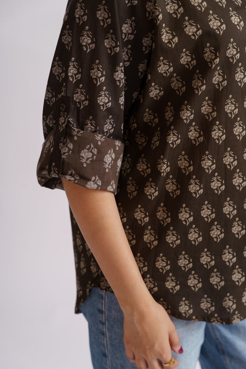 Brown floral print shirt front angle view with roll-up sleeves