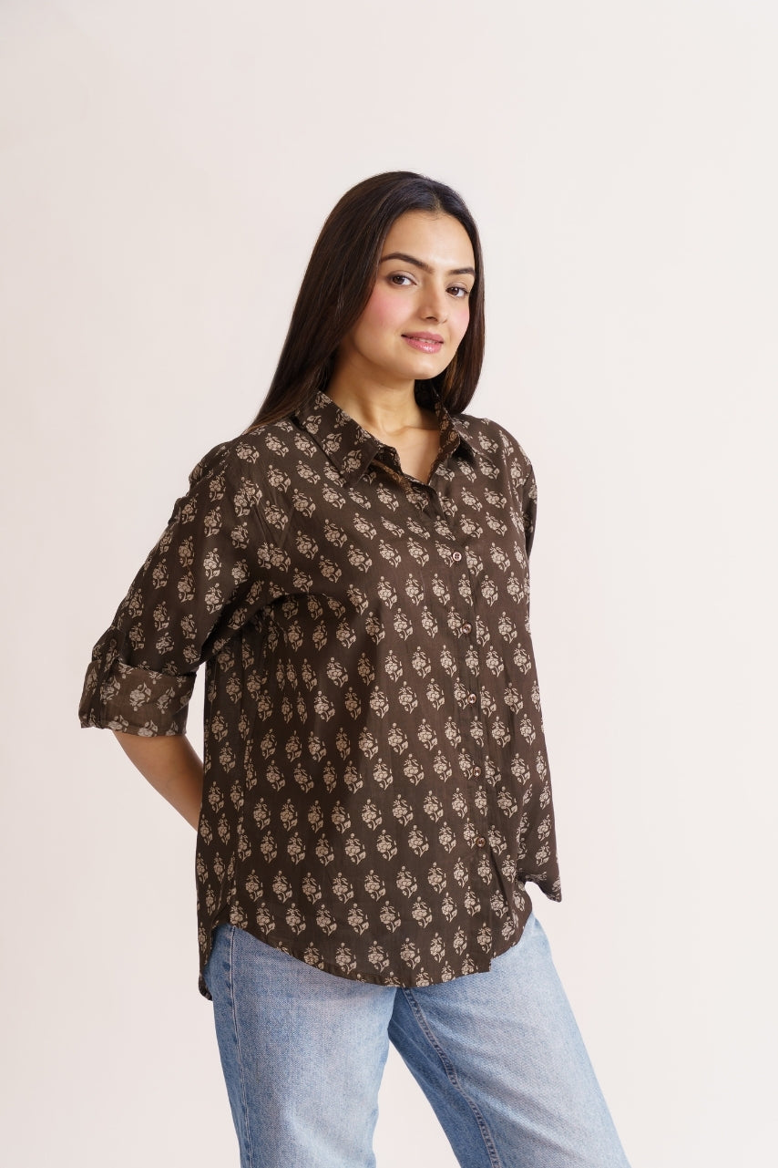 Close-up of brown and beige booti print on cotton shirt fabric