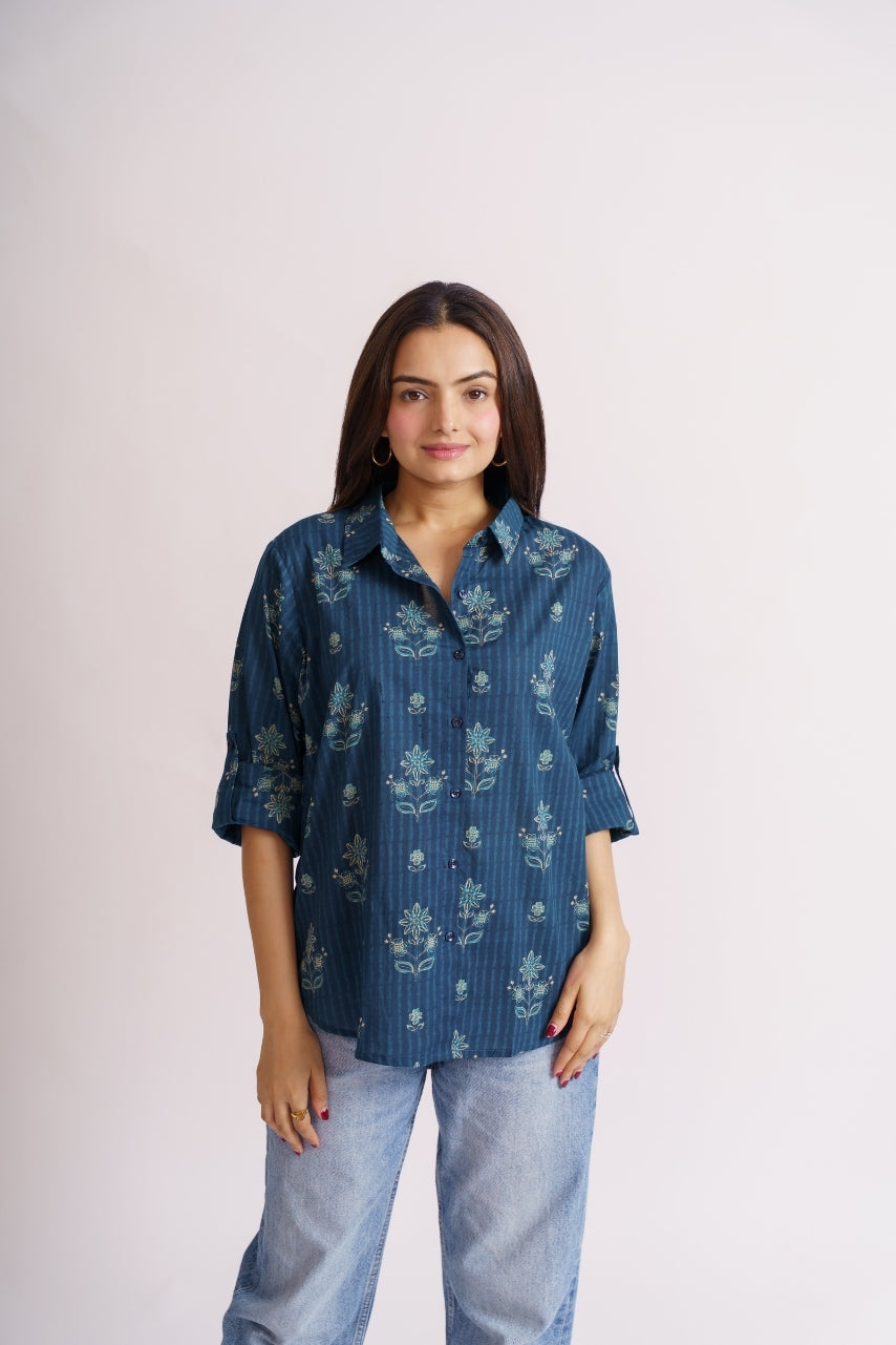 Teal floral print shirt front view with roll-up sleeves