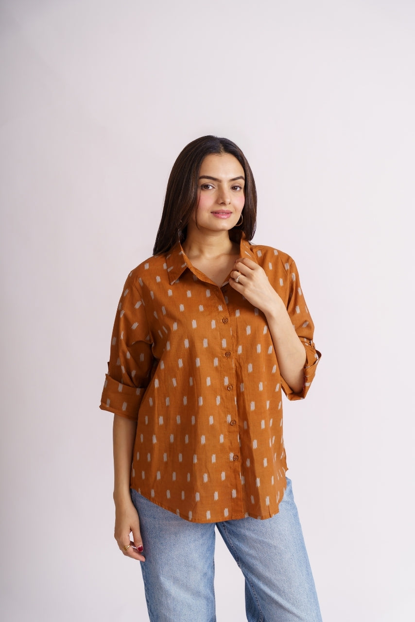 Rust ikat print shirt front view with roll-up sleeves