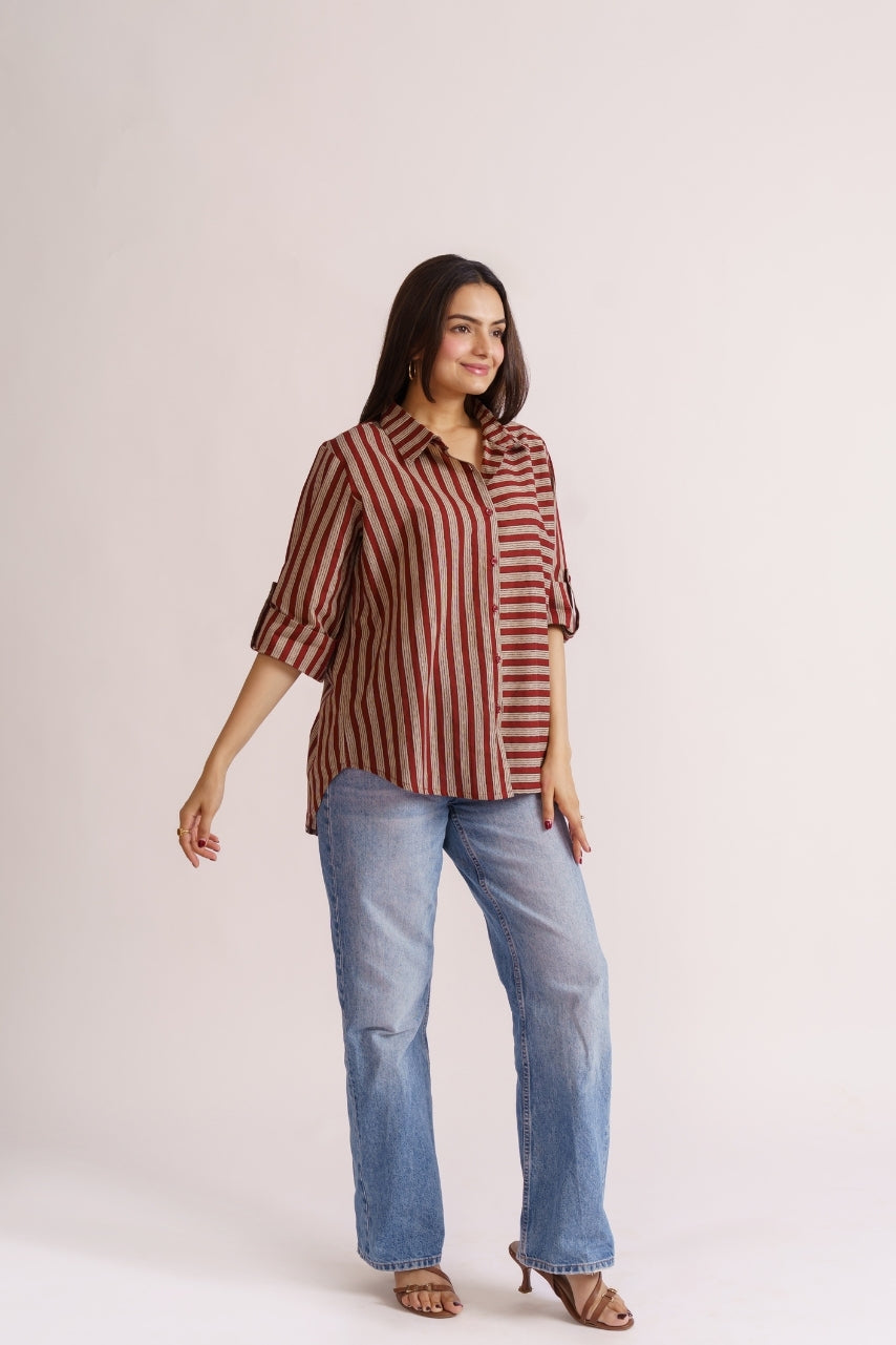 Woman wearing maroon stripe cotton button-down shirt with wide-leg jeans