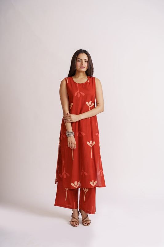 Woman wearing rust red sleeveless kurta palazzo set, front view