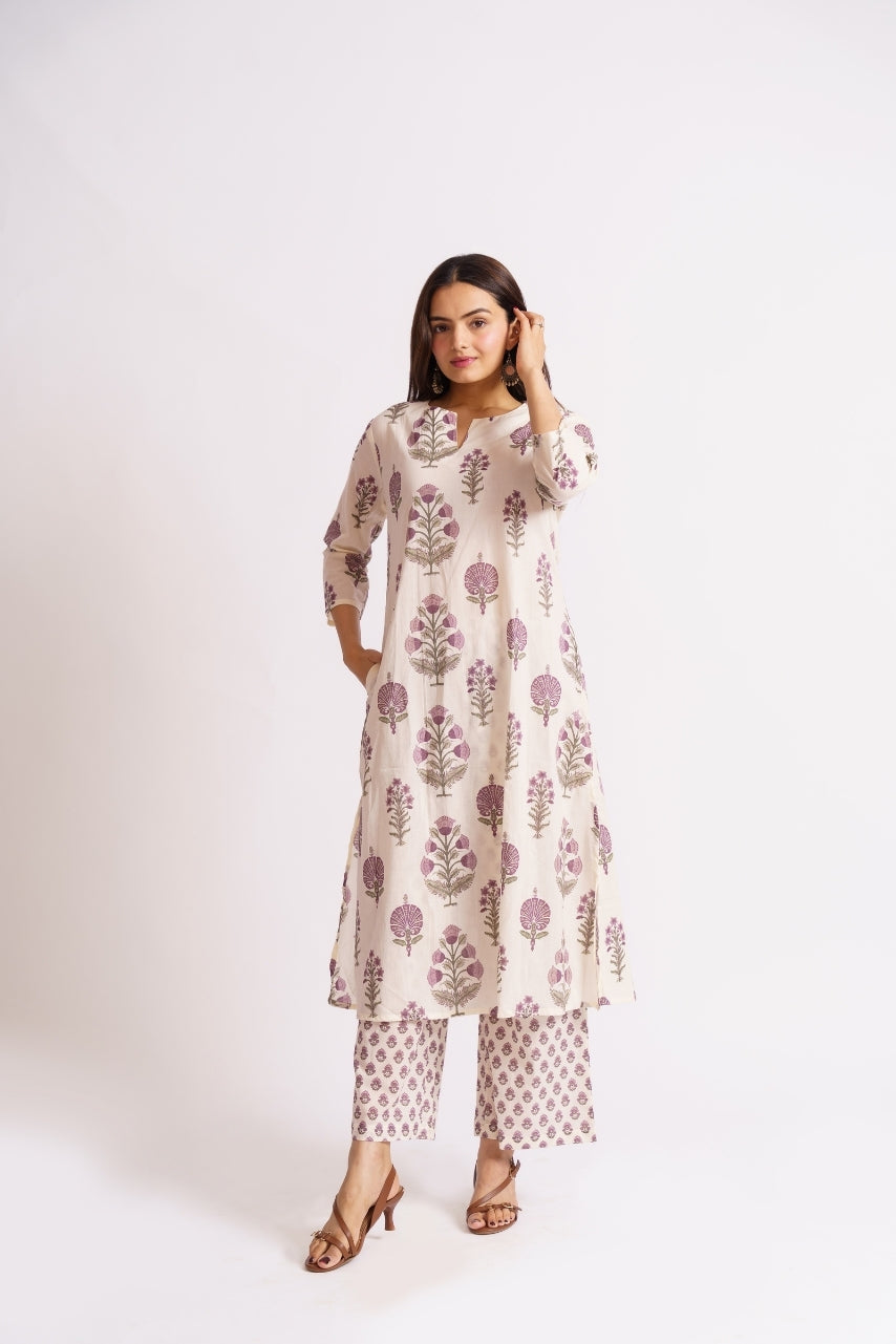 Woman wearing cream floral block print cotton kurti, front view