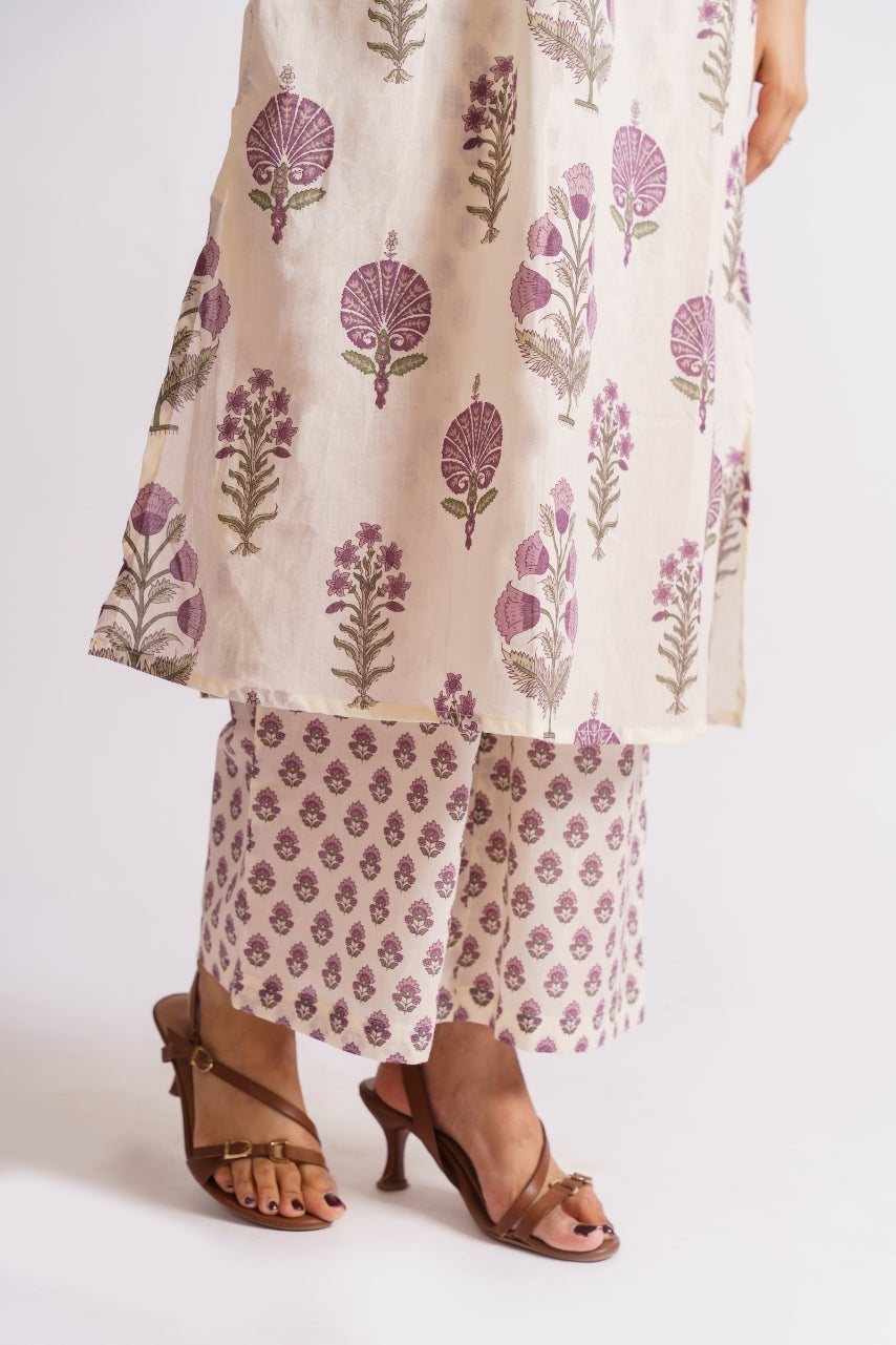 Cream floral block print set styled with gold earrings