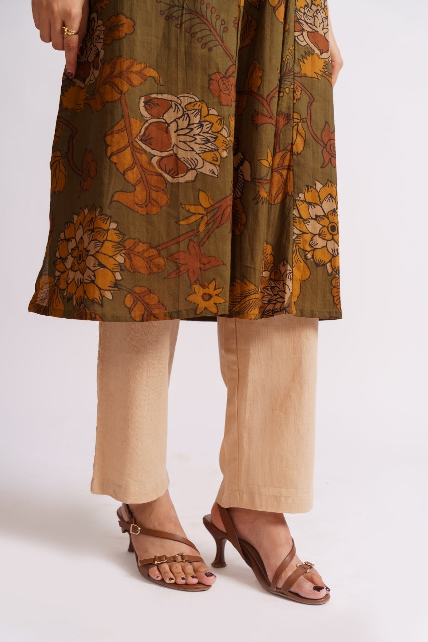 Model wearing full-length olive floral palazzo set, standing pose