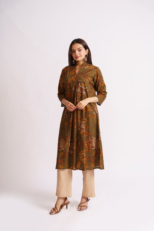 Woman wearing olive floral print cotton kurti, front view