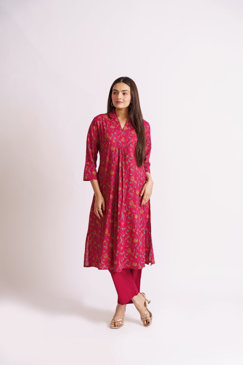 Woman wearing magenta vine floral cotton co-ord set, front view