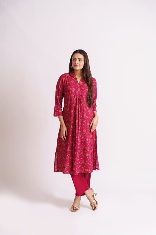 Woman wearing magenta vine floral print cotton kurti, front view