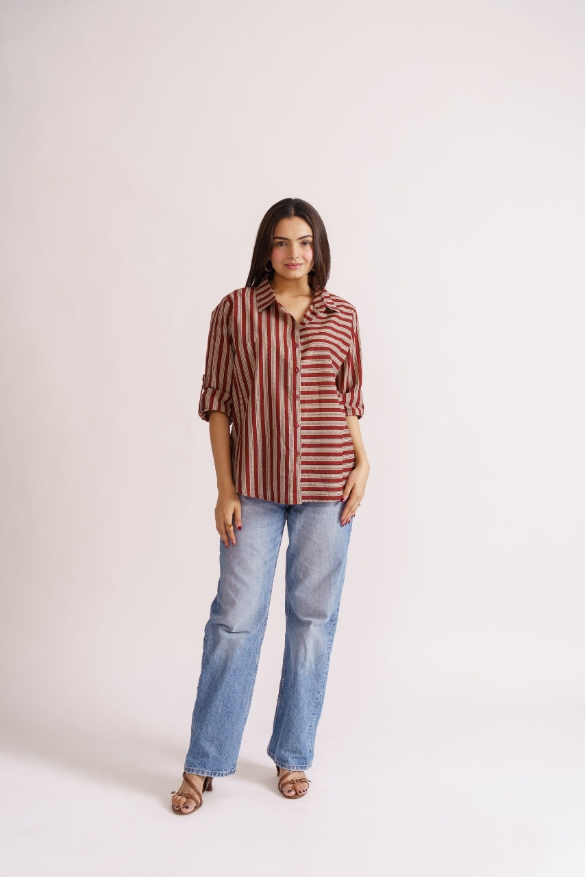 Woman wearing maroon stripe cotton button-down shirt with wide-leg jeans