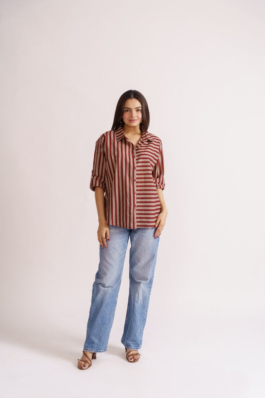 Woman wearing maroon stripe cotton button-down shirt with wide-leg jeans