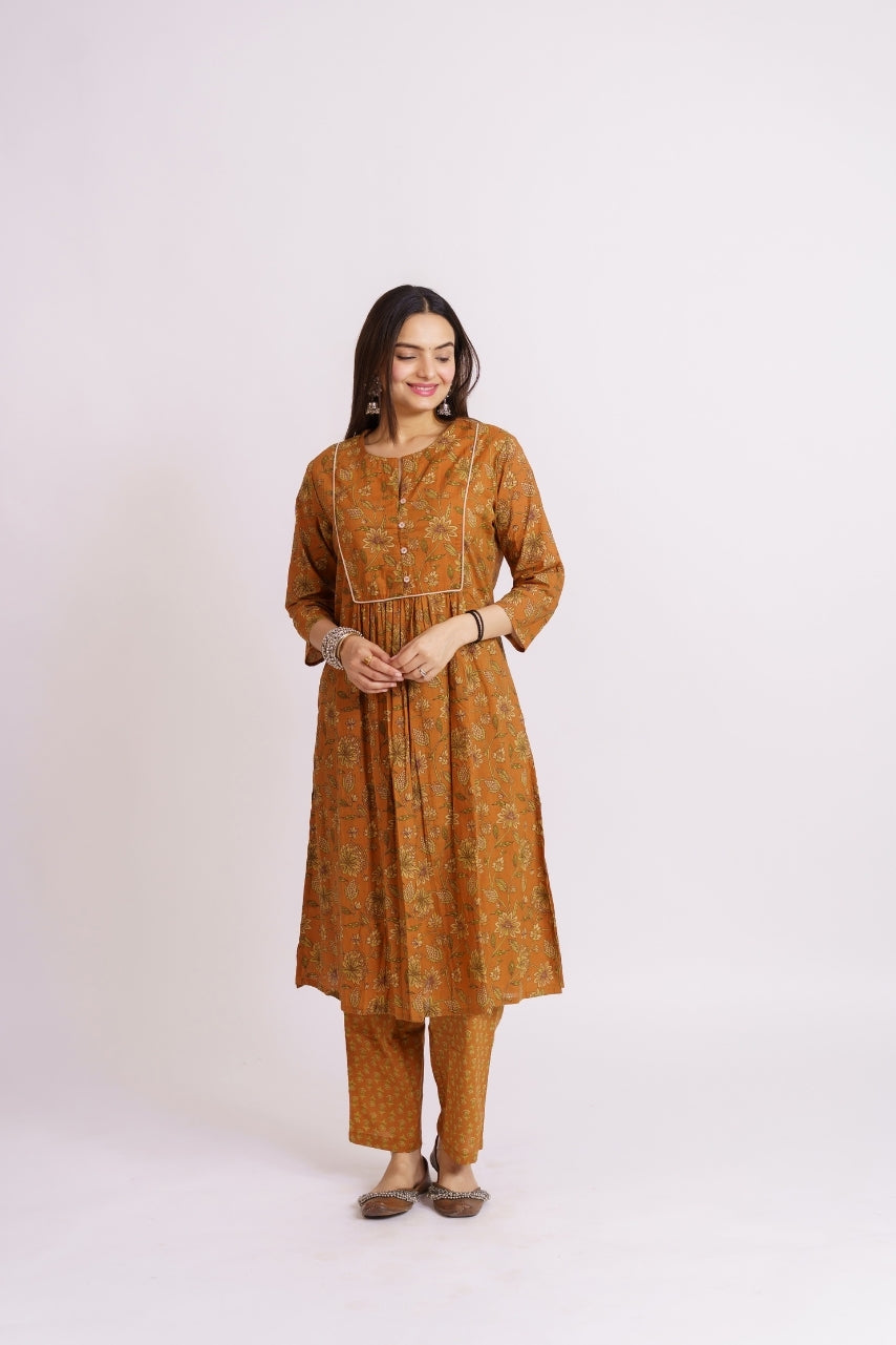 Gathered mustard yellow kurta with piped yoke detail