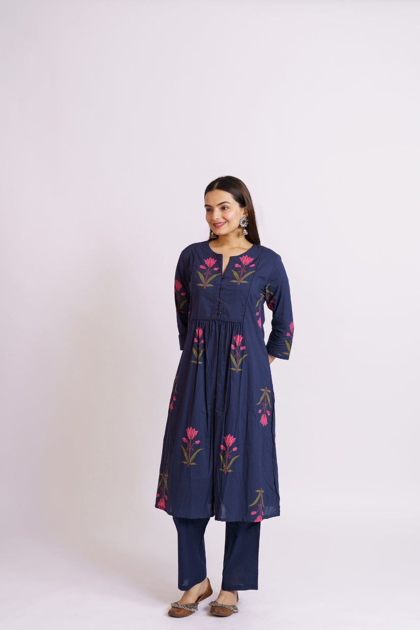 Close-up of pink floral block print on navy cotton kurta