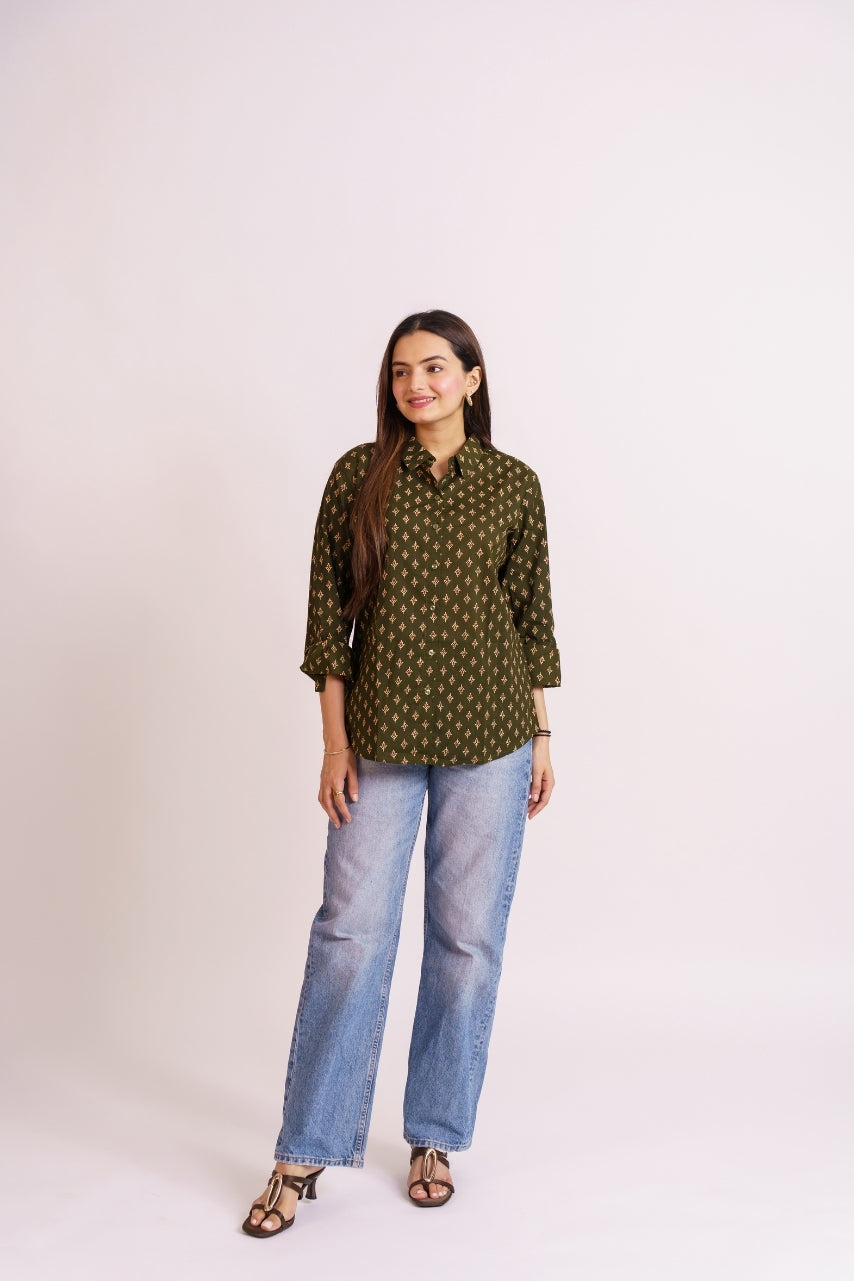 Woman wearing olive cotton shirt with collar and button placket detail