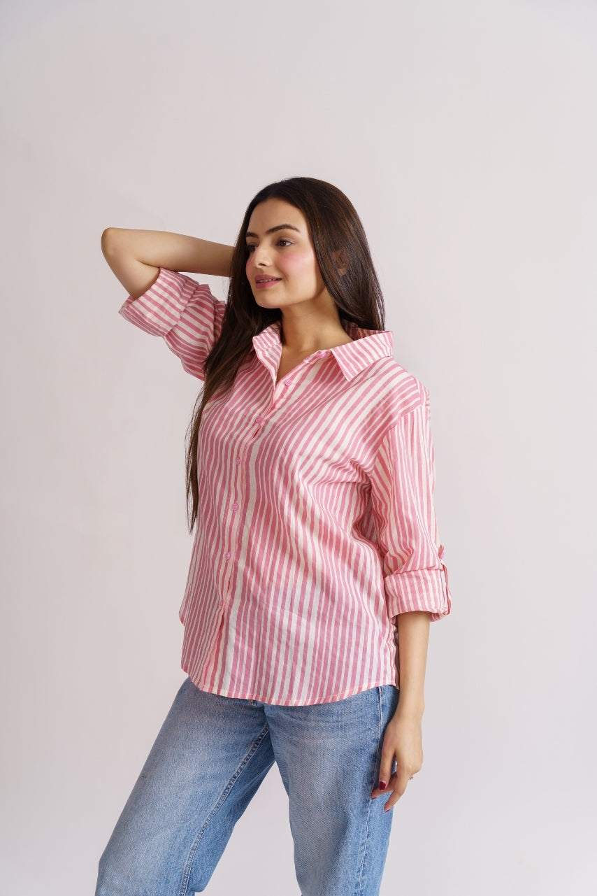 Close-up of pink candy stripe pattern on cotton shirt fabric