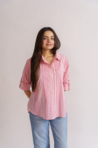 Pink stripe shirt styled with blue denim jeans, casual outfit