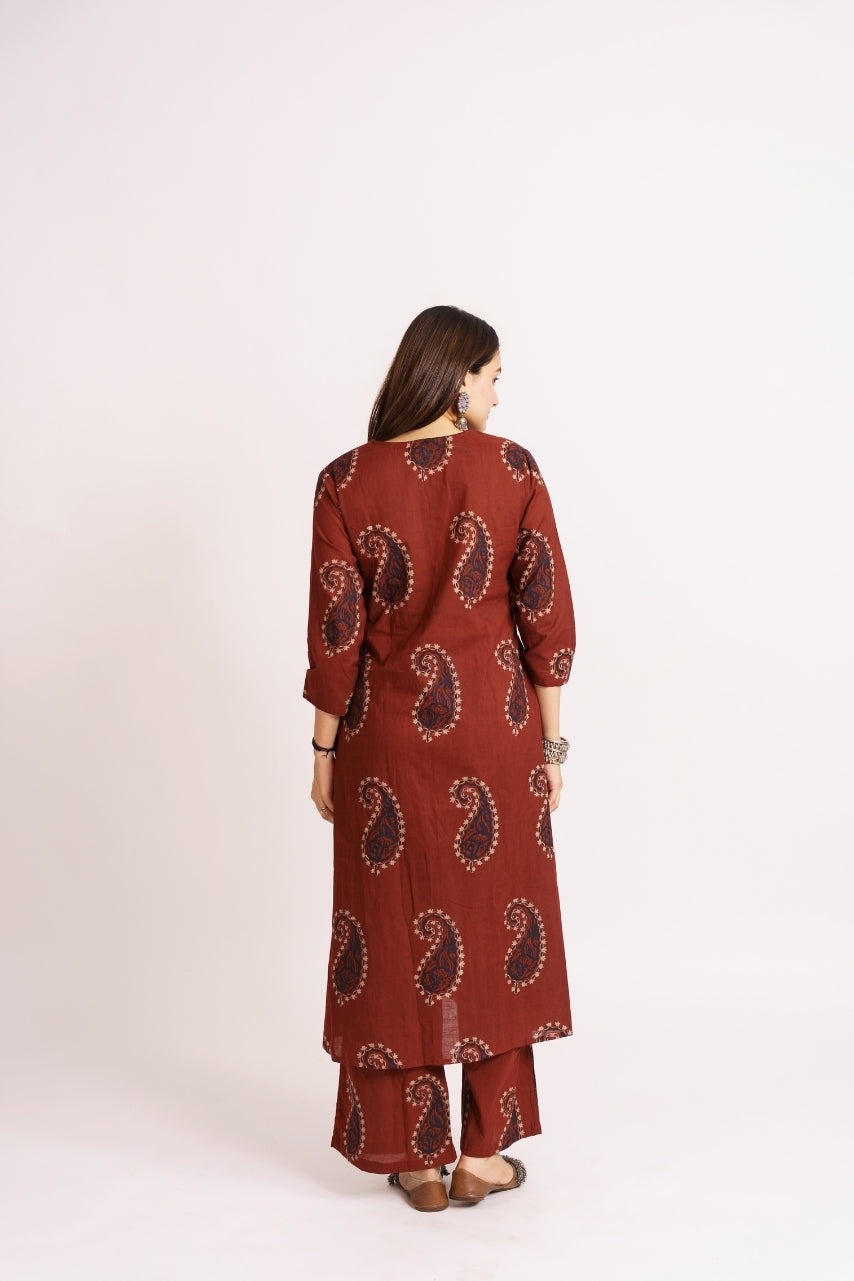 Close-up of navy paisley block print on rust cotton kurta