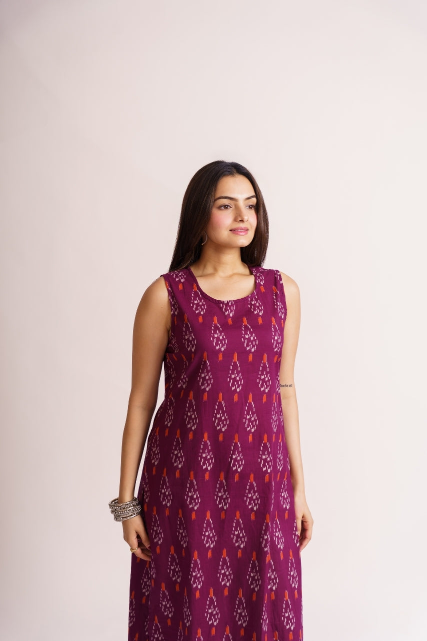 Model wearing full-length magenta ikat kurta set, standing pose