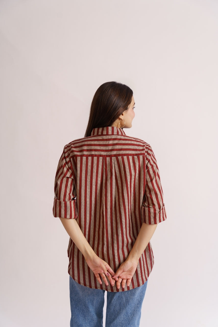 Maroon stripe shirt styled with light-wash denim jeans