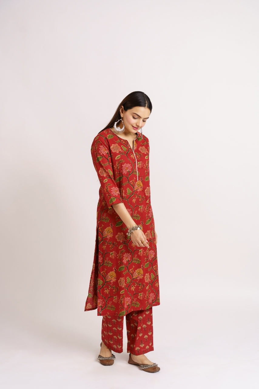 Red printed kurta set styled with jhumka earrings