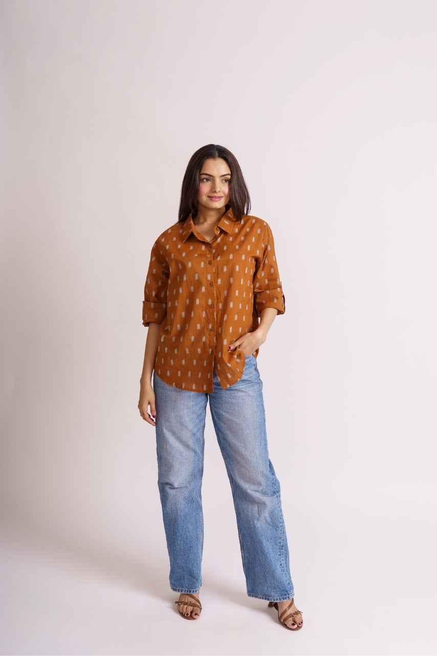 Rust ikat shirt styled with blue denim jeans, casual outfit