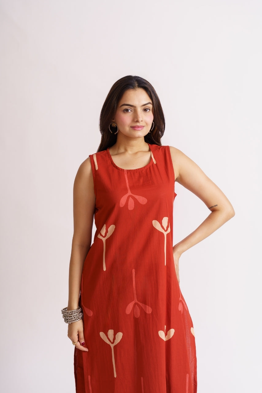Rust red palazzo set styled with statement bangles
