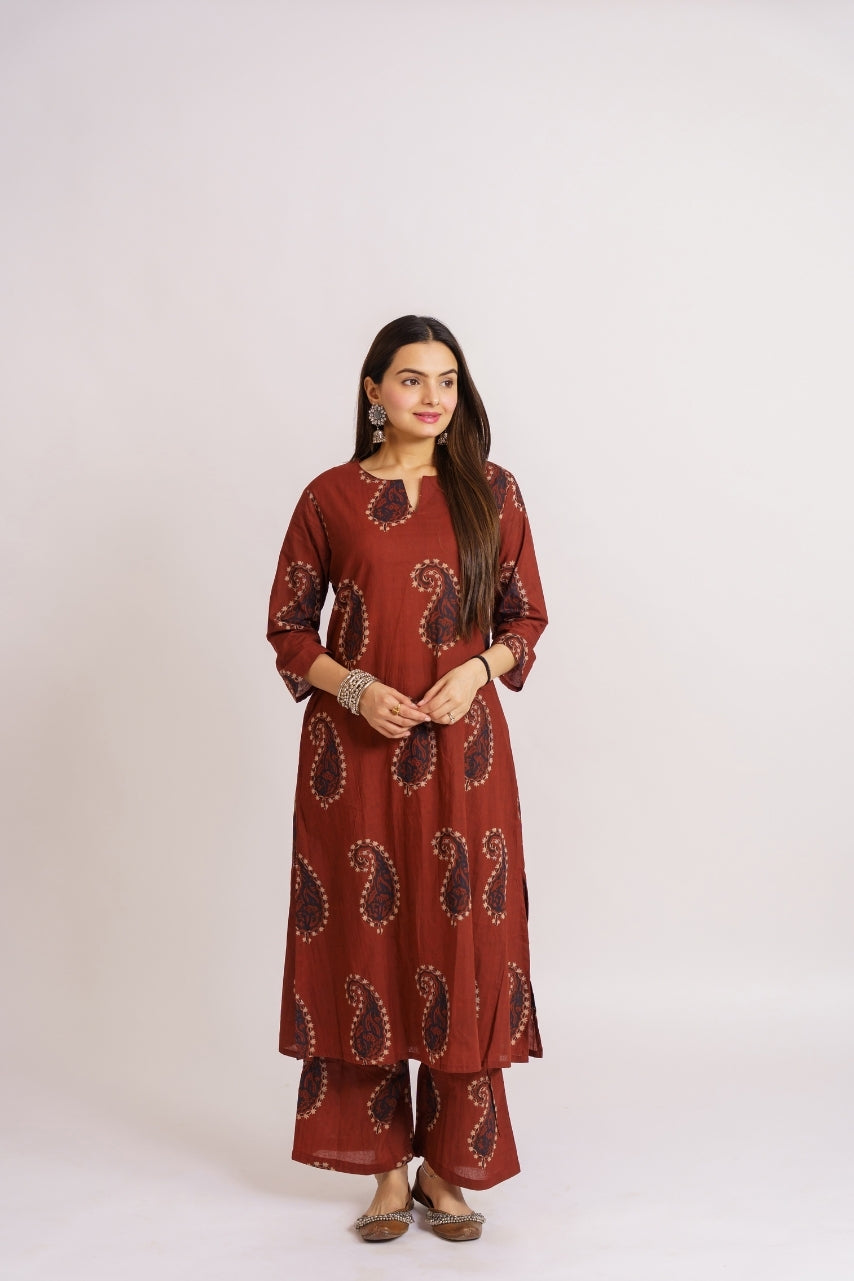 Rust printed kurta set styled with oxidized jhumka earrings