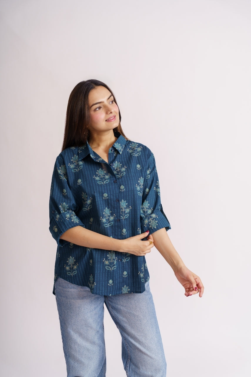 Teal floral print shirt front view with roll-up sleeves