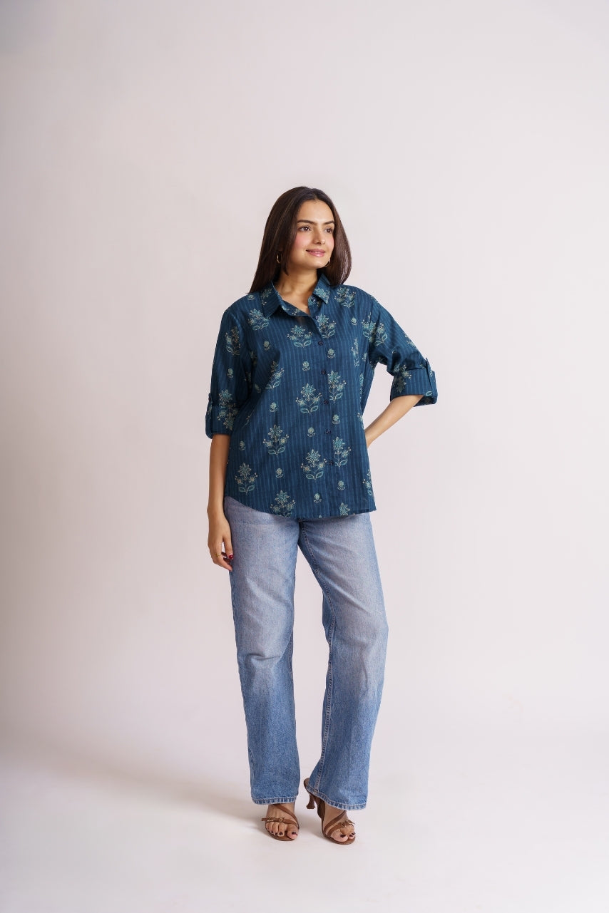 Teal floral shirt styled with blue denim jeans, casual outfit