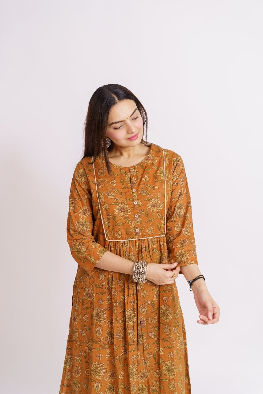 Mustard printed kurta set styled with jhumka earrings