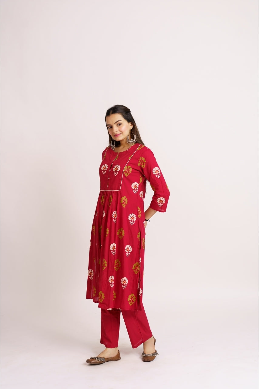 Crimson printed kurta set styled with silver jhumka earrings