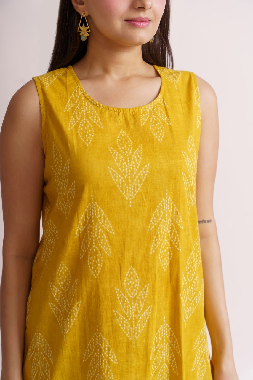 Close-up of tonal leaf print pattern on yellow cotton fabric