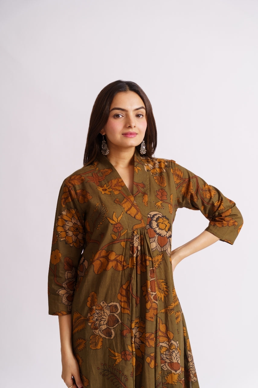 Model wearing full-length olive floral palazzo set, standing pose