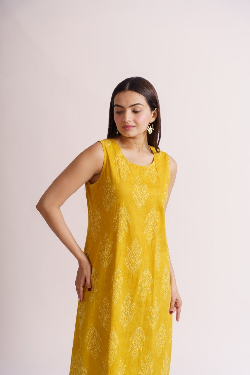 Yellow leaf print palazzo set styled with gold earrings